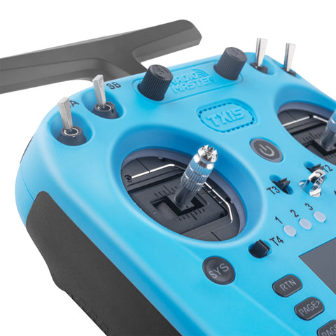 Close-up of TX15 Radio Controller in Iceberg Blue, showing V5.0 hall sensor gimbals, 3.5-inch IPS touchscreen, tilt-enabled gyro, and interchangeable shoulder switches for FPV and RC control.