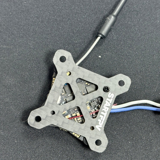 STARTFPV FPV racing drone flight controller board installed in drone setup, highlighting system integration and usability